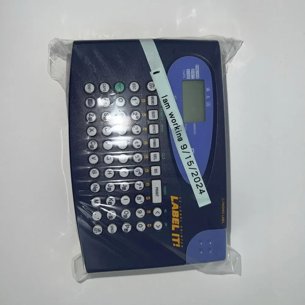Casio LABEL IT! EZ-Label Printer Model # KL-60-L A Clear Tape Included Inside De